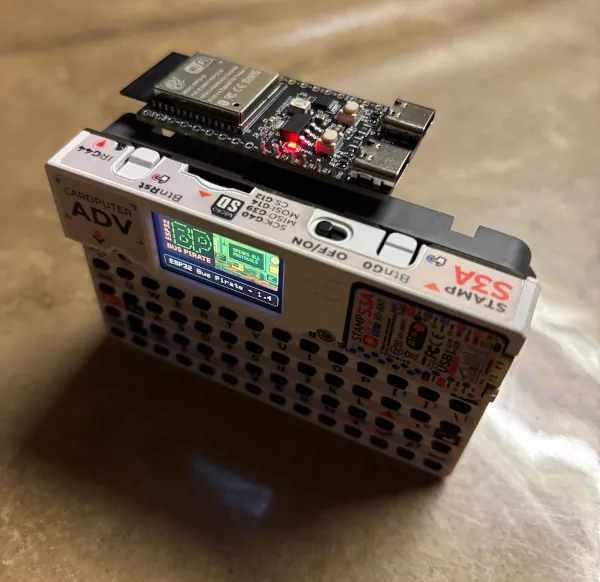 M5Stack Cardputer with an ESP32-C5 bus expander attached.
